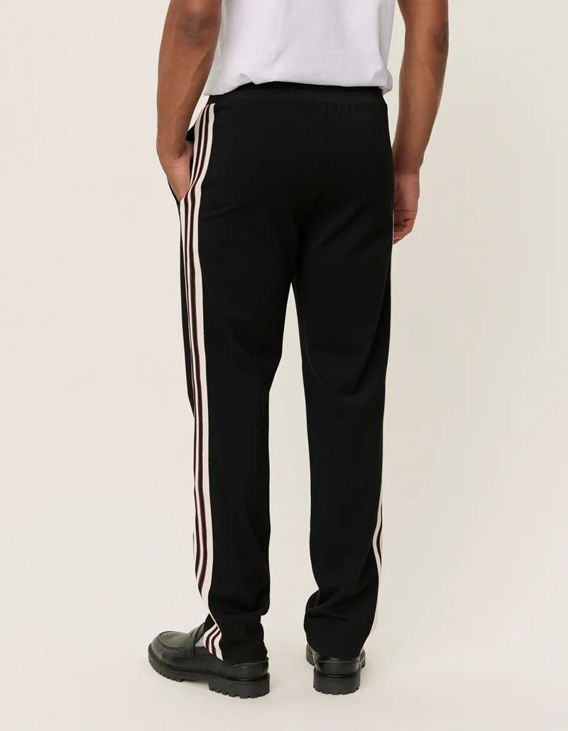 Black track pants with white stripe sale